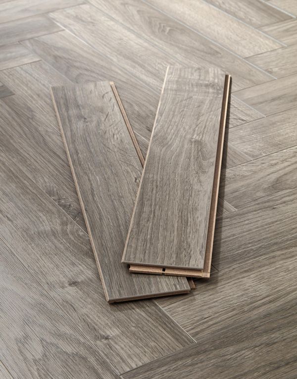 vintage chateau herringbone light grey laminate flooring
