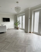 vintage chateau herringbone light grey laminate flooring