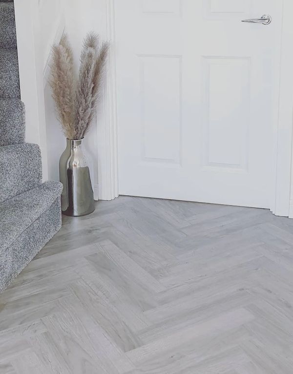 vintage chateau herringbone light grey laminate flooring